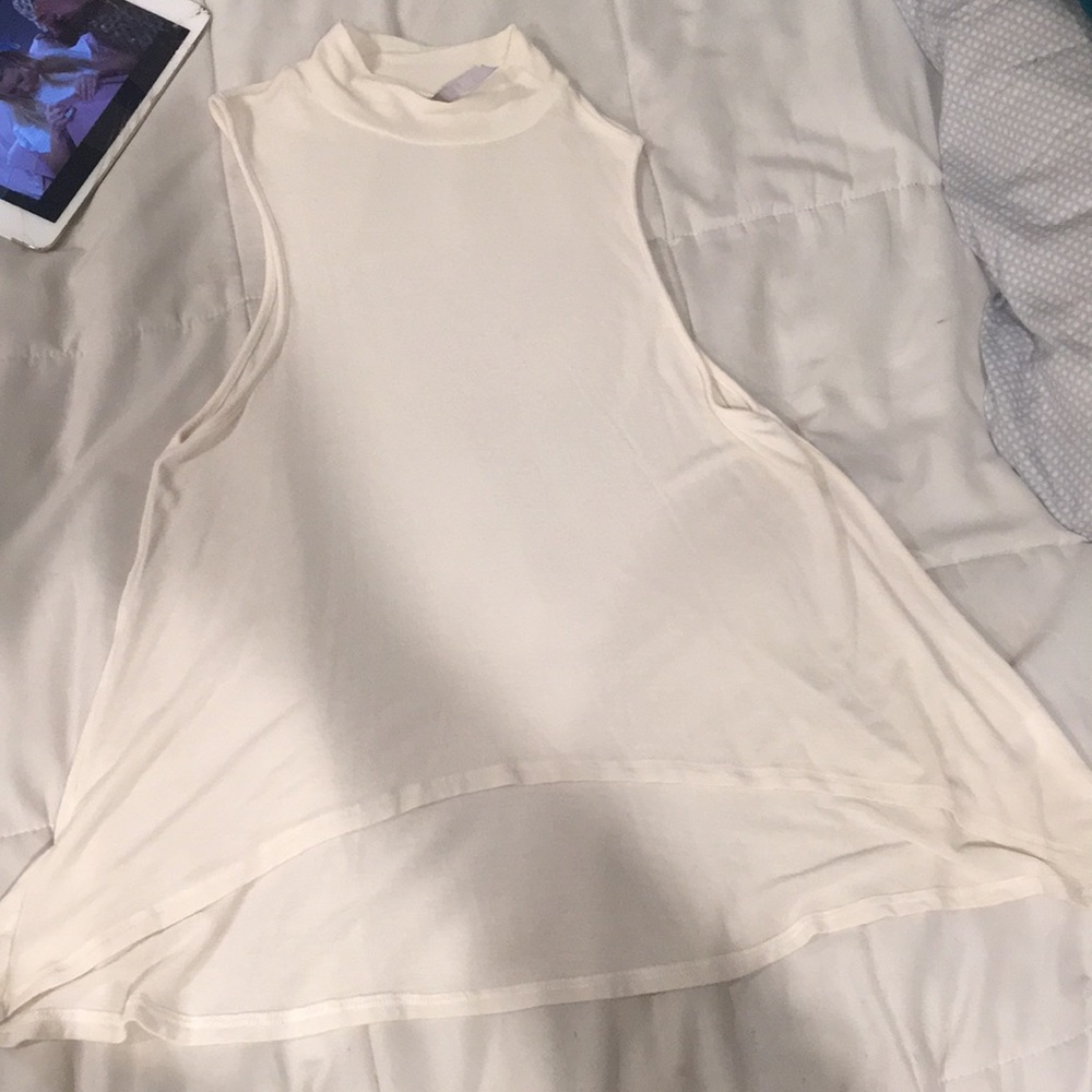 White and grey turtle neck tops